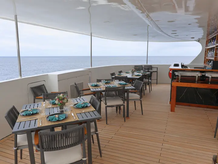 Open-air dining deck of a first-class Galápagos yacht